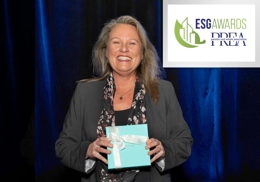 Photo of Deborah La Franchi, Founder & CEO of SDS Capital Group holding the ESG Award at the PREA 2023 Spring Conference.